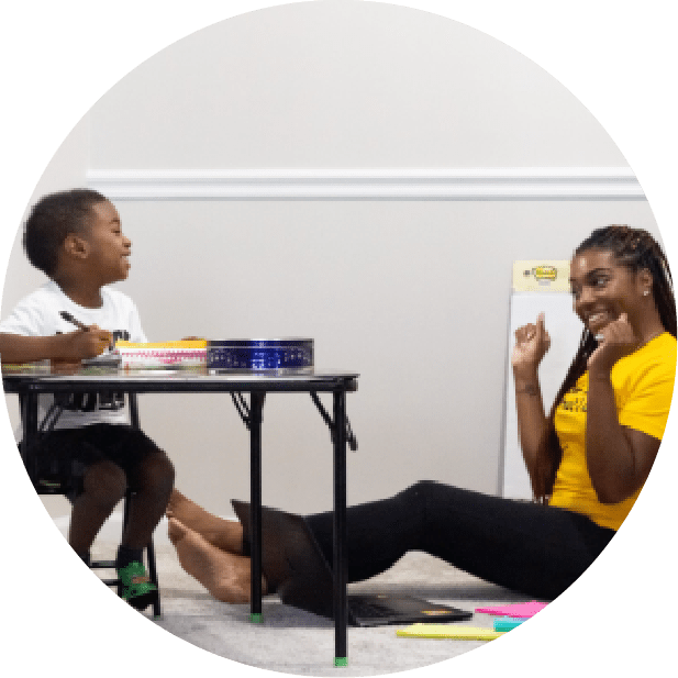 A woman and child sitting on the floor