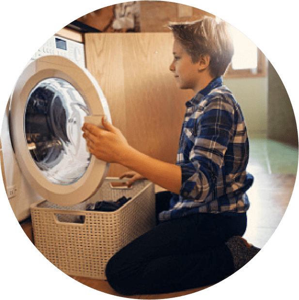 A man is fixing the washer in his home.