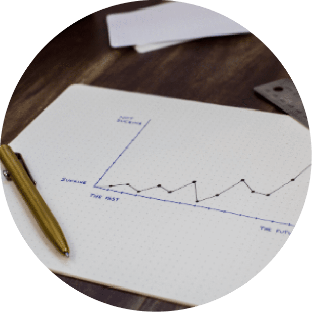 A pen and paper with a graph on it